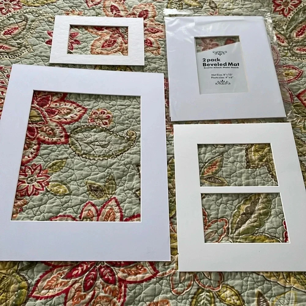 5 new/unused white picture frame mats. Sizes shown in pics.